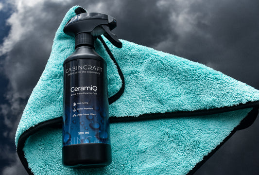 CabinCraft CeramiQ spray bottle on a teal towel against a dark background